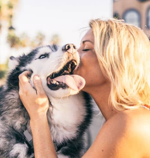 Dog mom giving kisses